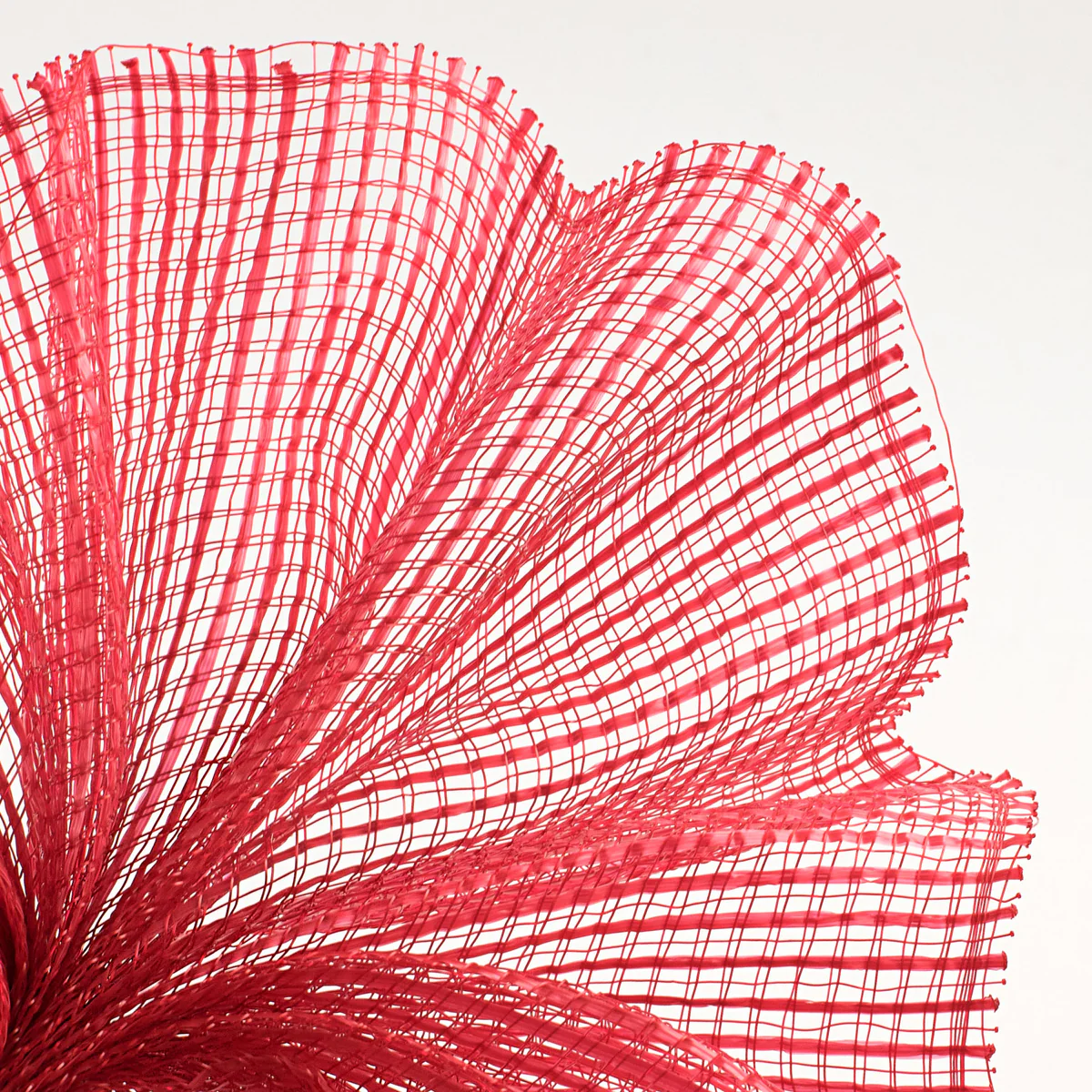 Close-up of a textured red horizontal wide stripe deco mesh weave fanned