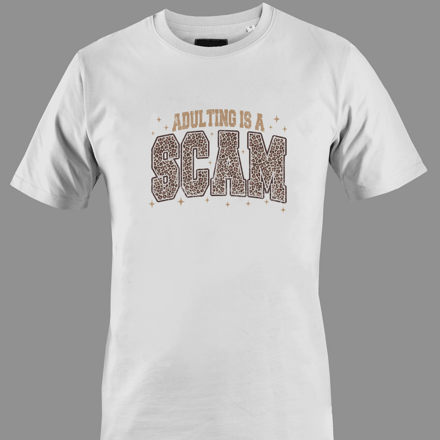 White t-shirt with 'Adulting is a Scam' text