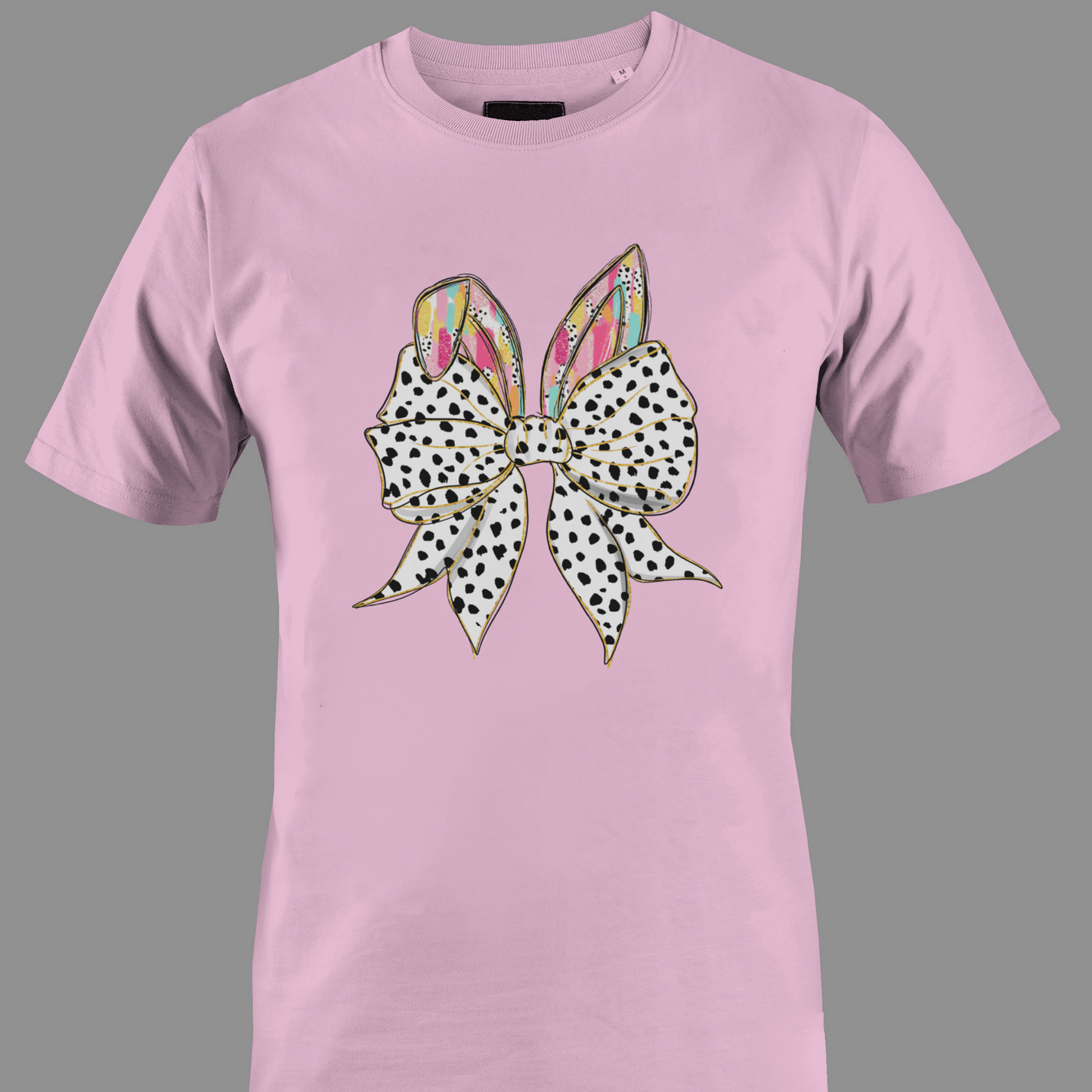 Light pink t-shirt with a large polka dot bow and colorful rabbit ears