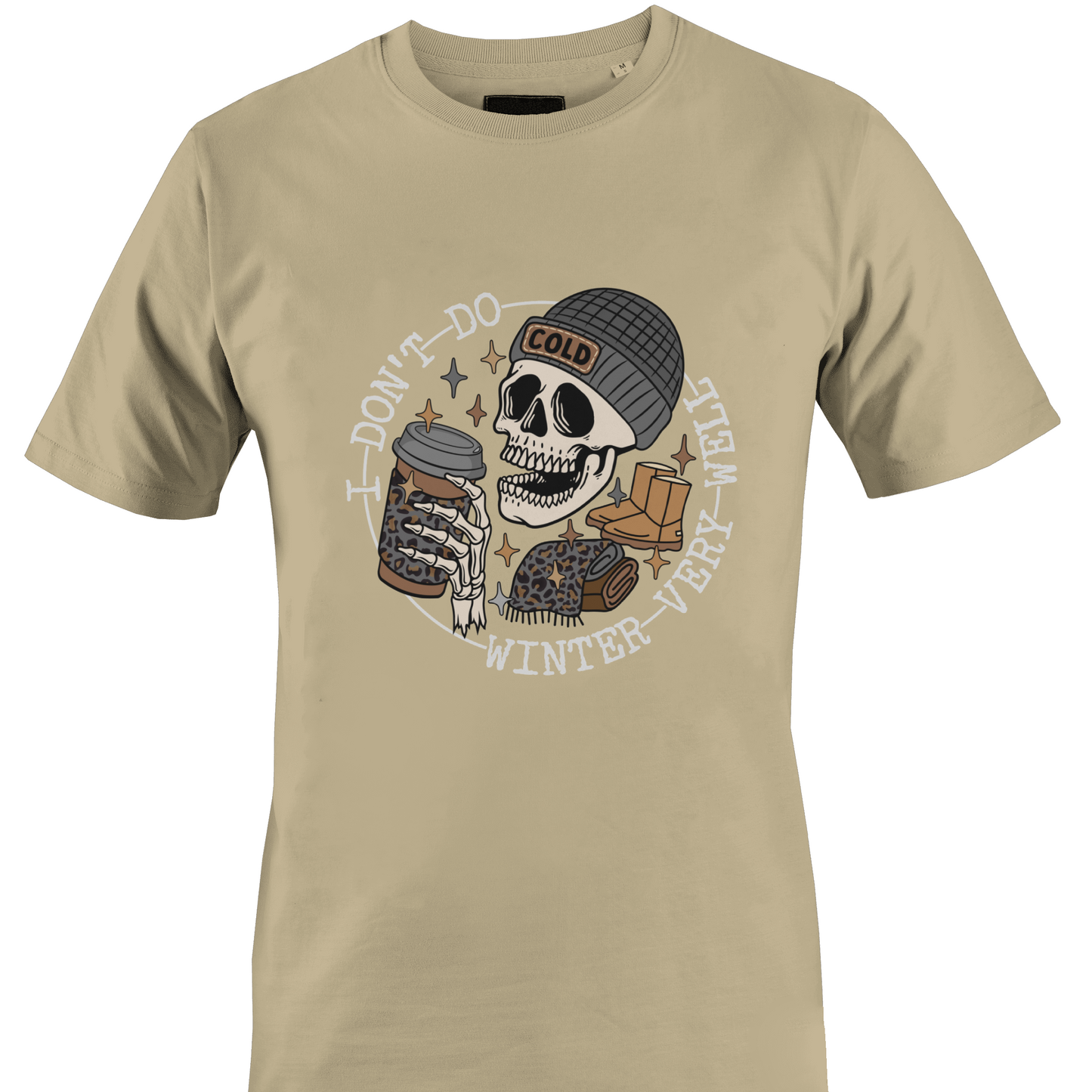 Tan t-shirt with a skeleton wearing a hat, ugg boots, a scarf and a coffee and the text "I don't do winter very well" by Monkey's Creations.