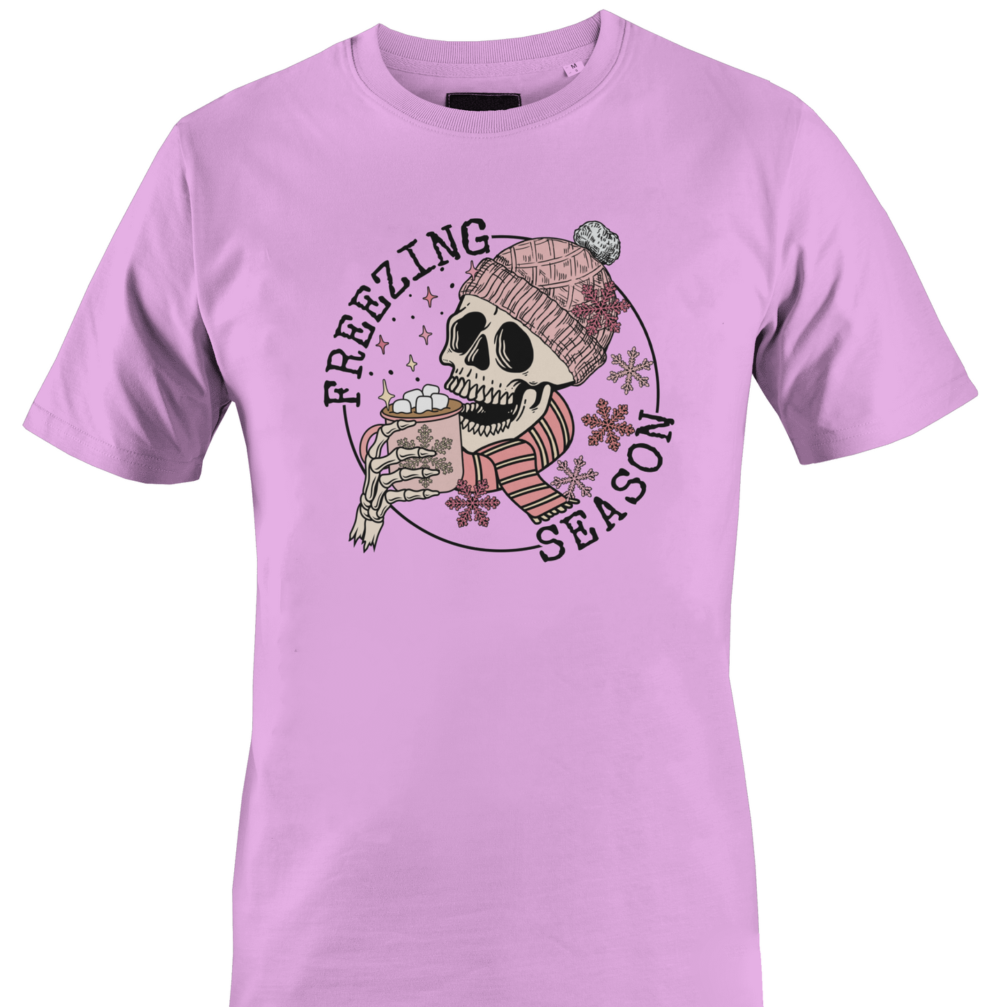Pink t-shirt with a skull wearing a hat and scarf with a hot chocolate and the text "freezing season" by Monkey's Creations.