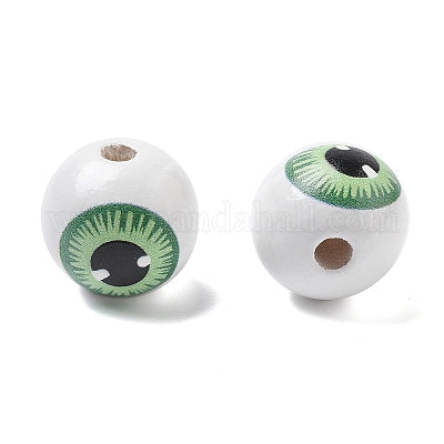 Painted white wooden beads with green eyeballs for crafting and wreath making