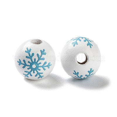 White painted round wooden beads with sky blue snowflakes for crafting and wreath making.