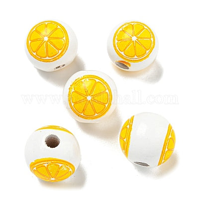 Painted white wooden beads with lemon slices for crafting and wreath making