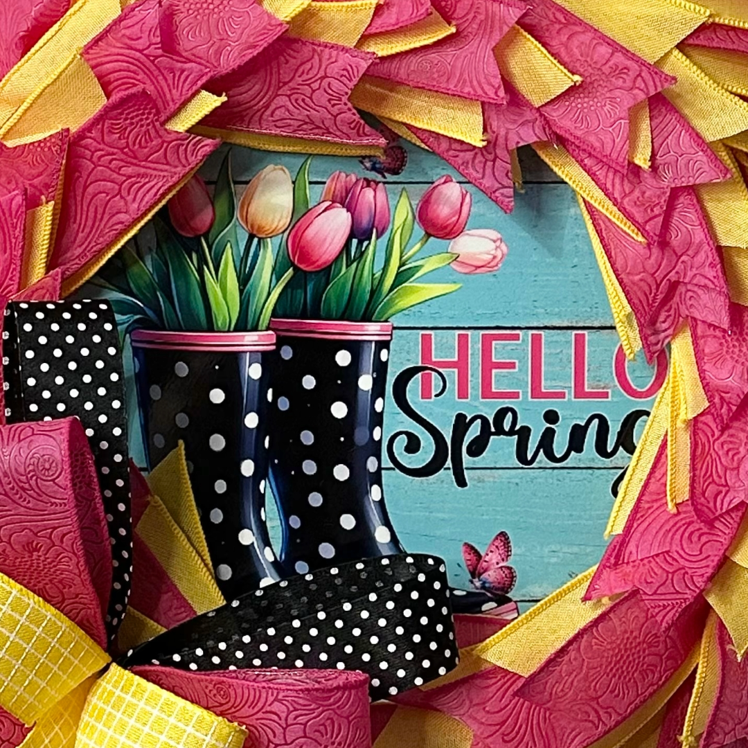 Dollar Tree all ribbon wreath featuring spring themed elements and a large ribbon bow