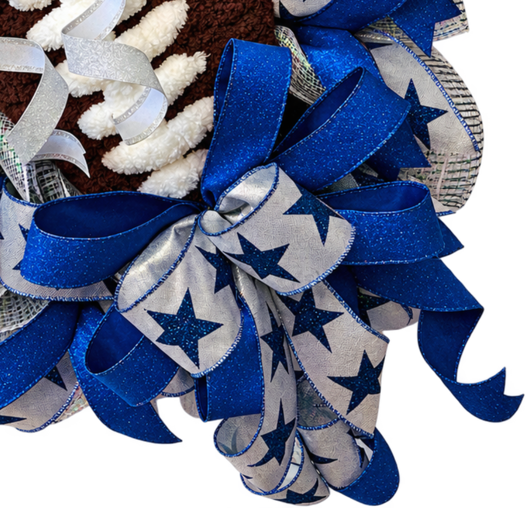 Royal blue, silver and grey deco mesh and wired ribbon wreath featuring stars and a chunky yarn football center by Monkey's Creations.