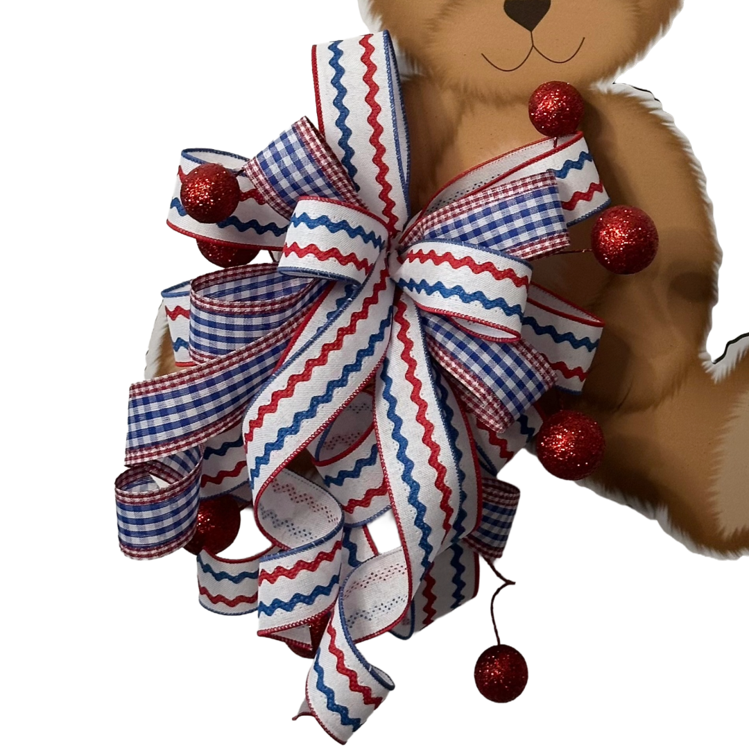 Patriotic bear door hanger with a red white and blue themed ribbon bow by Monkey's Creations