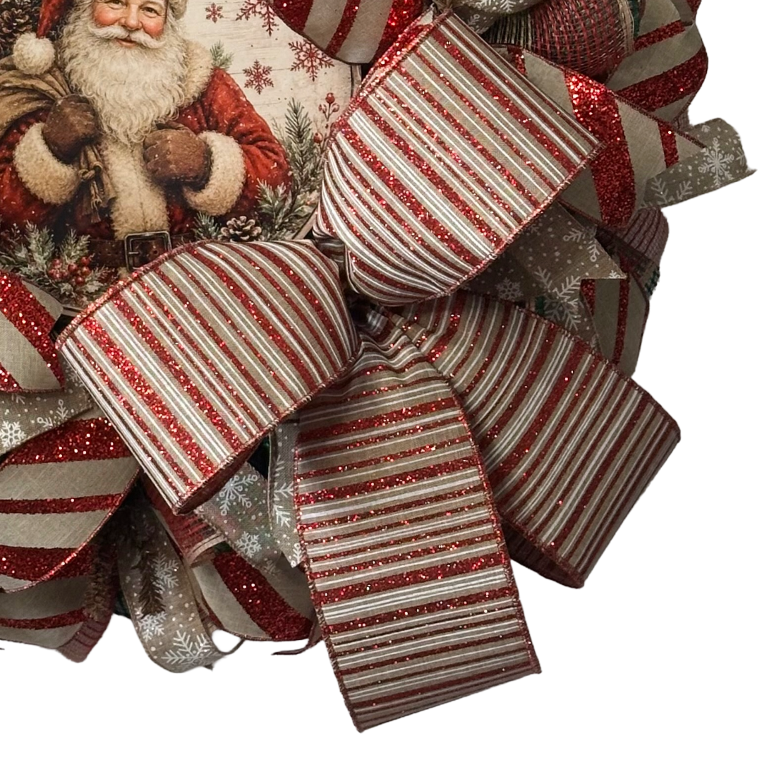 Deco mesh and ribbon wreath with a vintage santa center by Monkey's Creations.