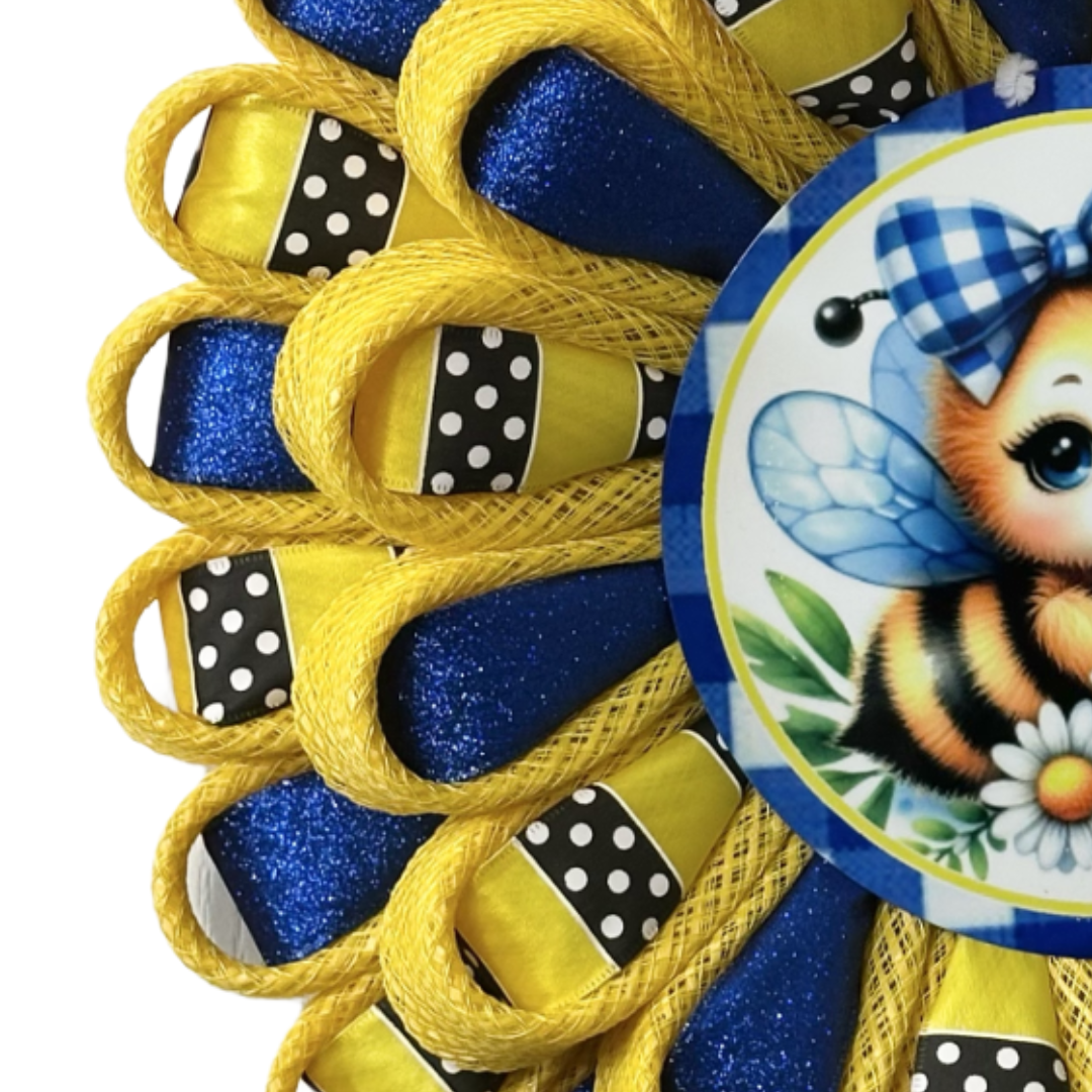 Flower wreath with yellow deco mesh, glitter royal blue ribbon, yellow with black and white polka dot ribbon and a bee with a plaid bow and daisies wreath sign