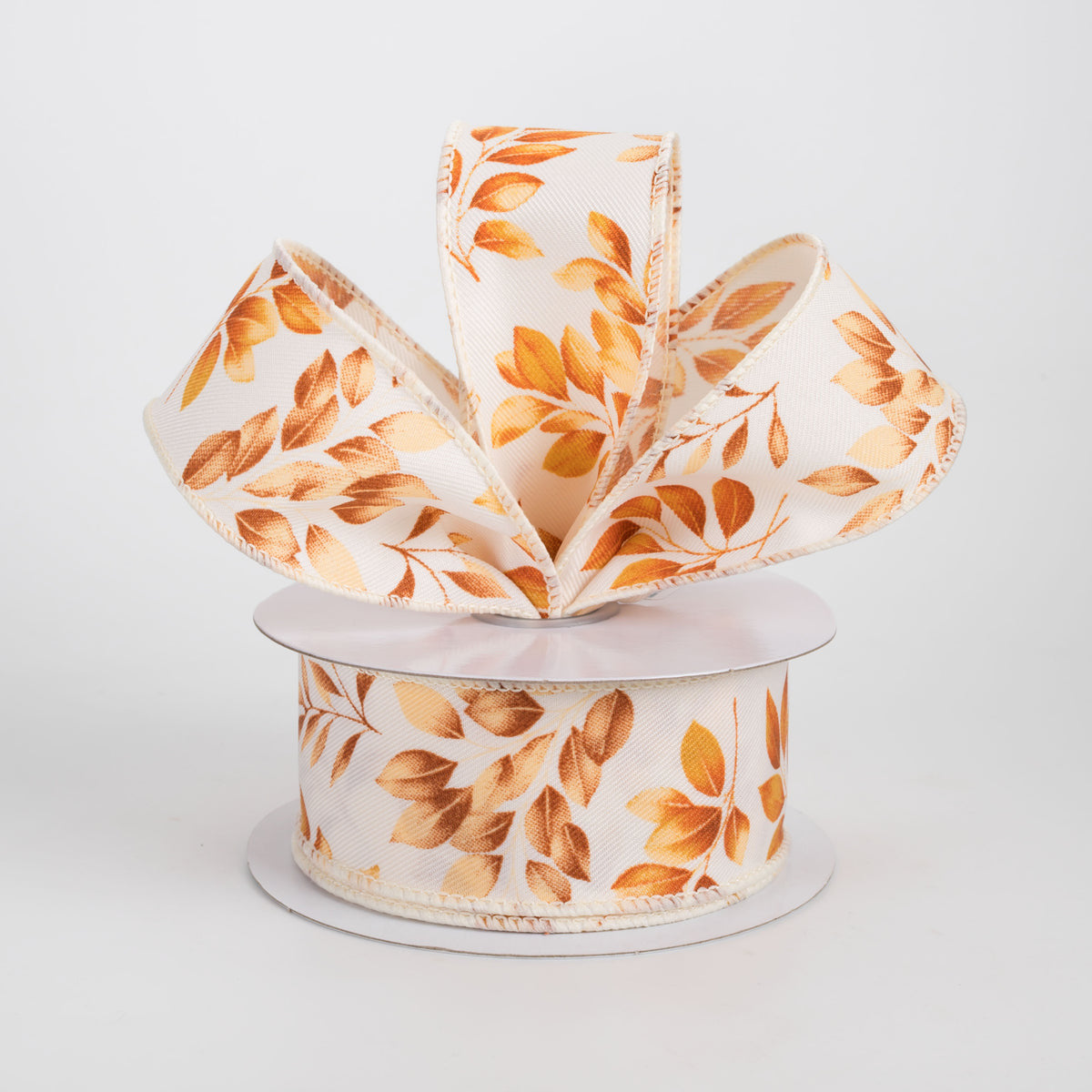 1.5 x 10 yard roll of wired ribbon with orange and brown leaves on ivory.