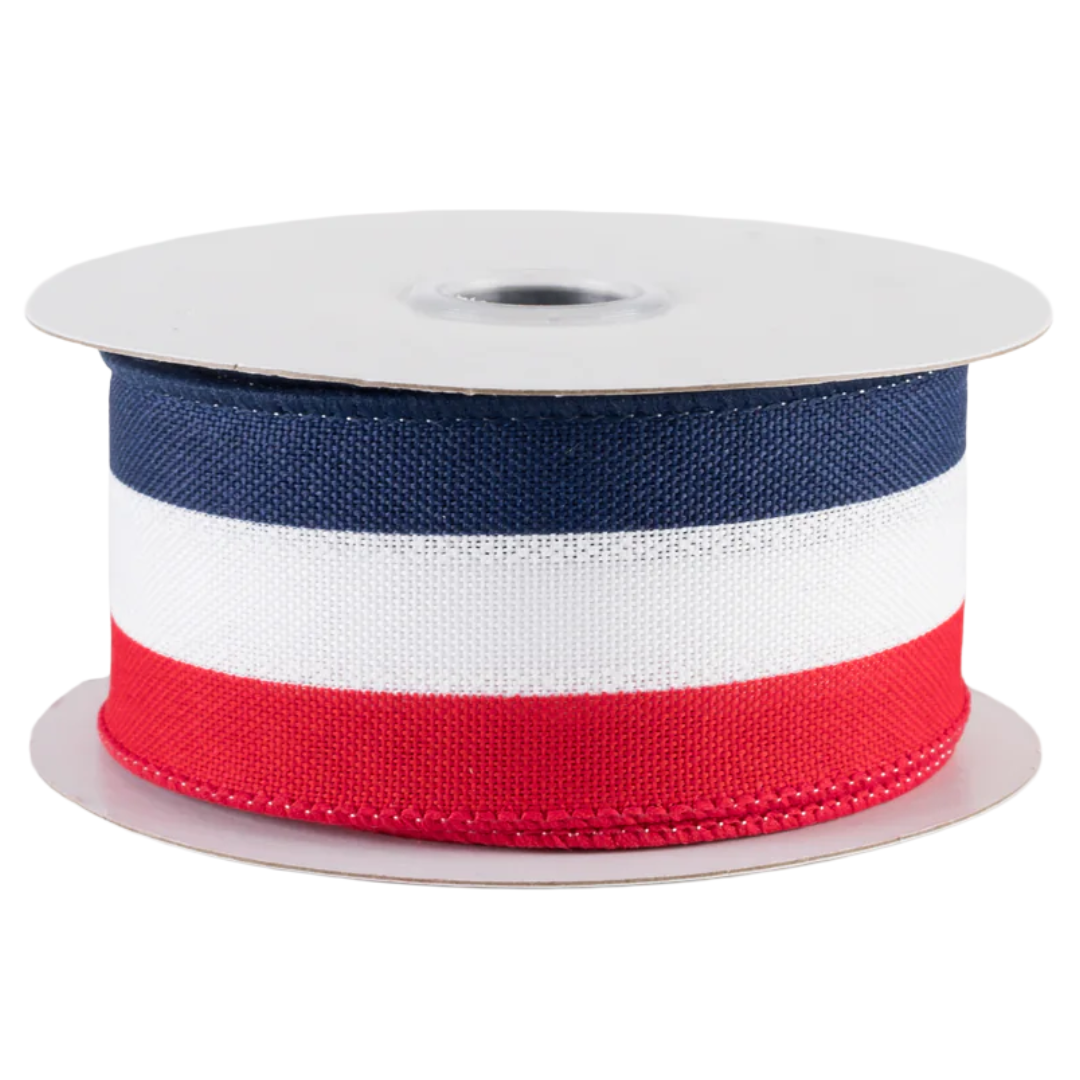 Spool of ribbon with red, white, and blue stripes 