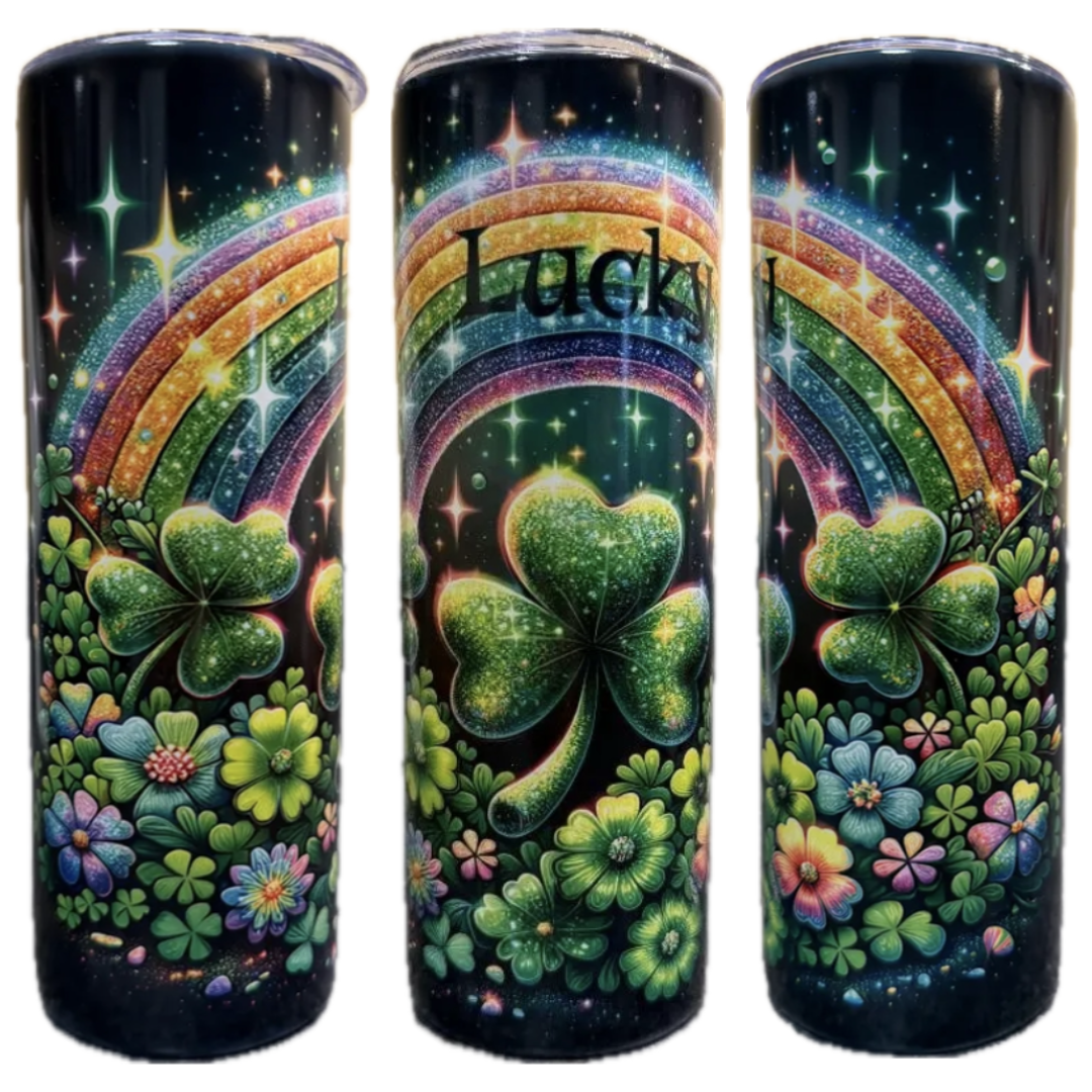 St Patrick's Day Lucky tumbler design featuring rainbows, shamrocks, and flowers on a black background.