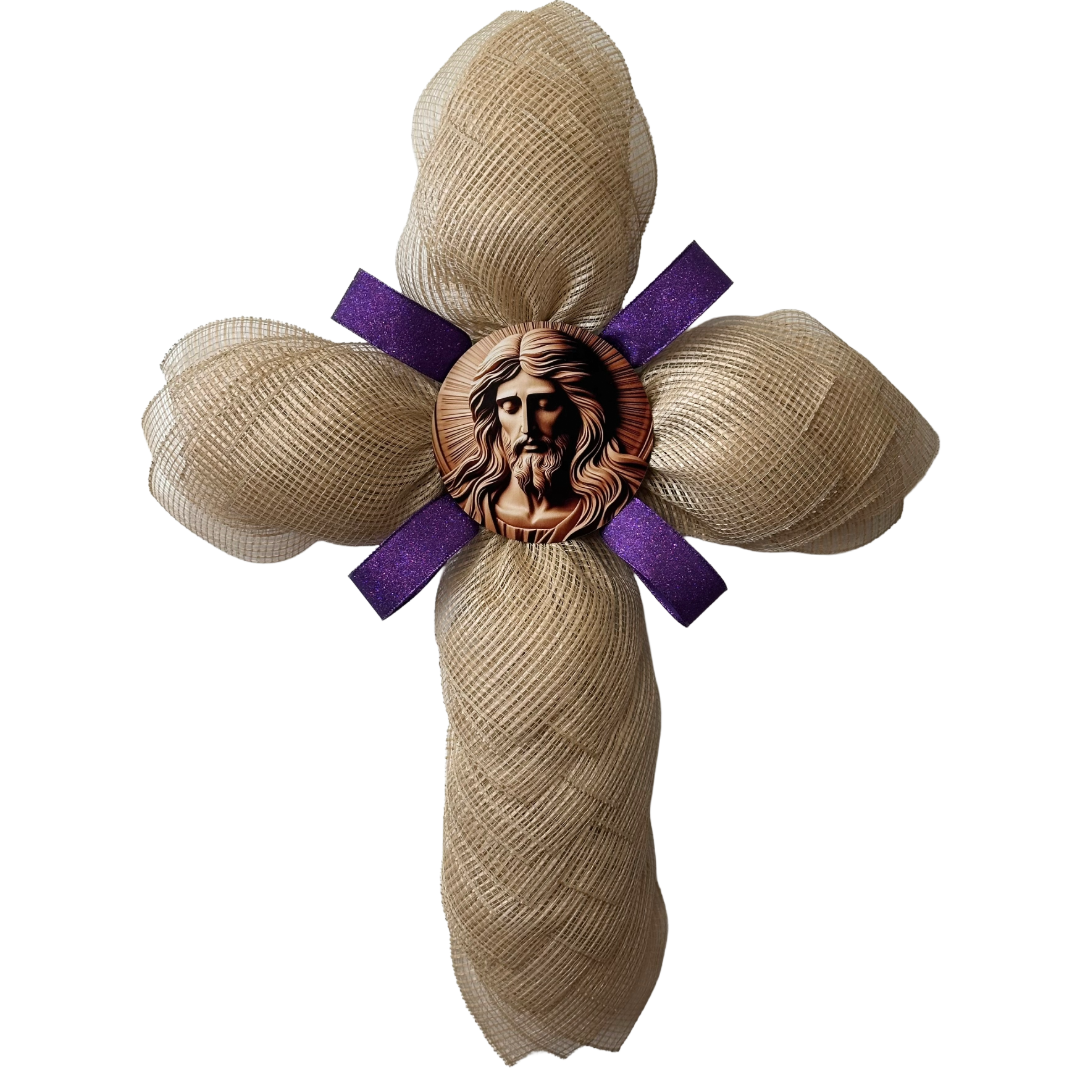Deco mesh cross wreath with a purple ribbon and am image of Jesus Christ