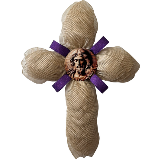 Deco mesh cross wreath with a purple ribbon and am image of Jesus Christ