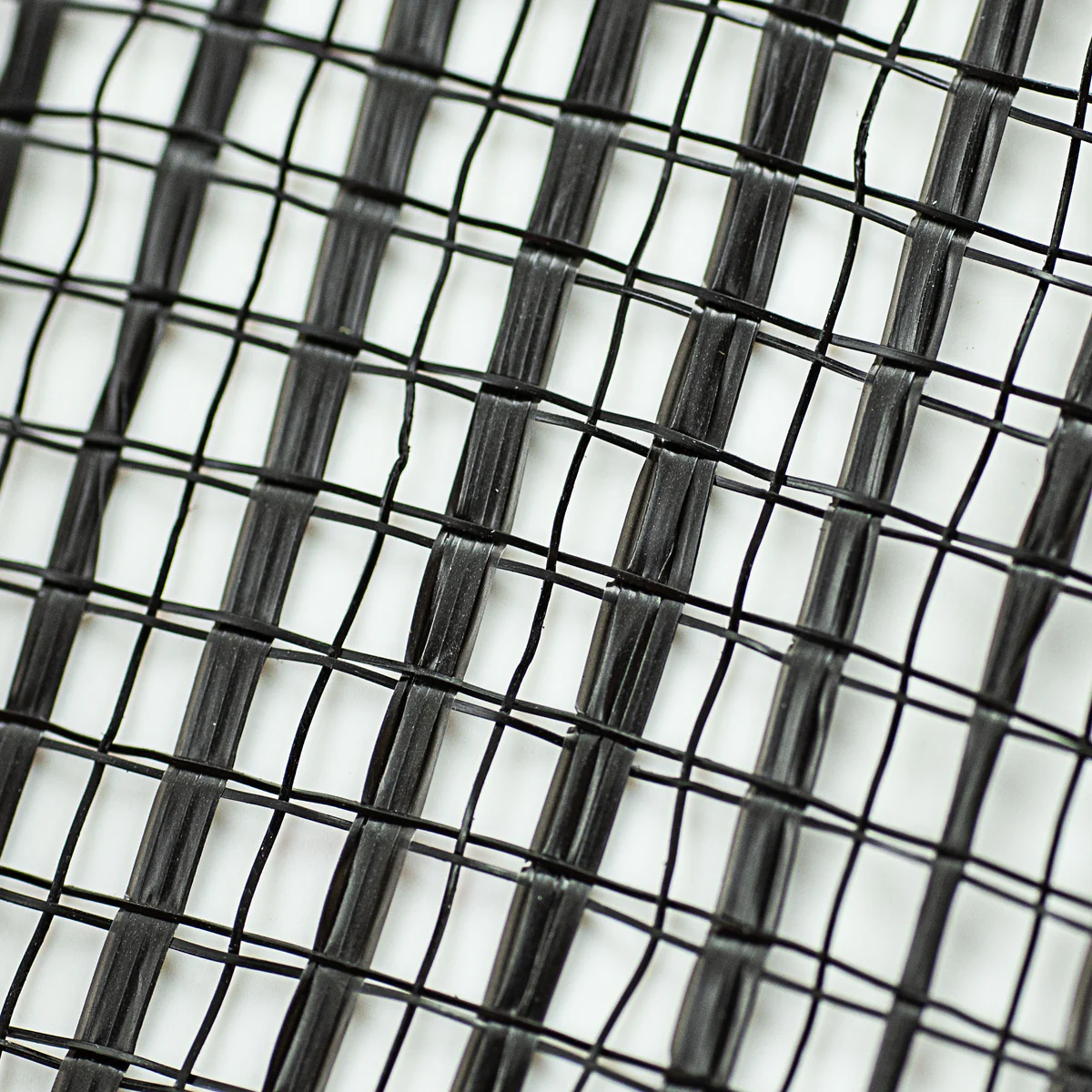 Close up of black horizontal wide stripe deco mesh weave carried by Monkey's Creations - MPN RE890002.