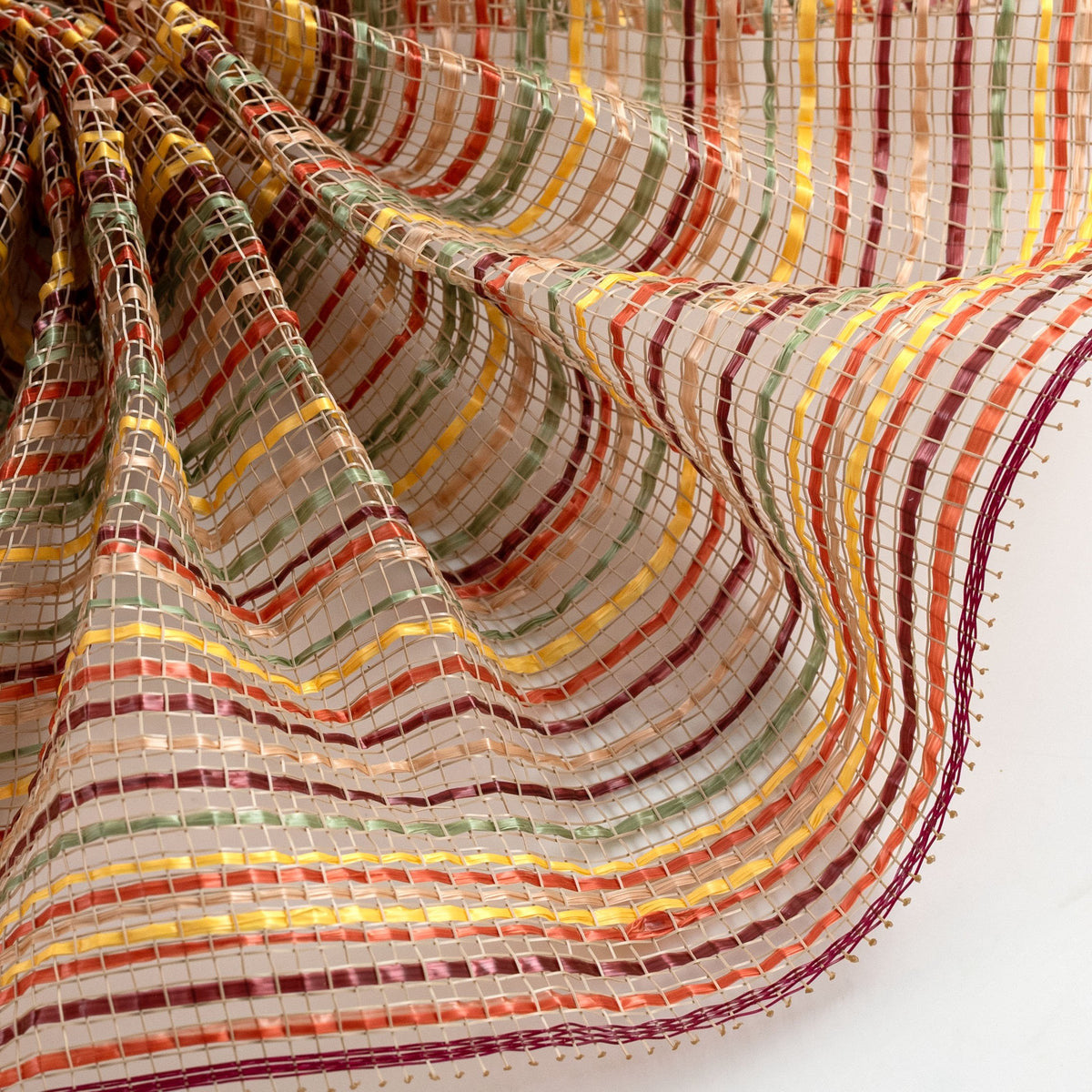 Close up of striation style natural, yellow, orange and sage "fall harvest" vertical wide stripe deco mesh weave carried by Monkey's Creations - MPN RE1369YJ