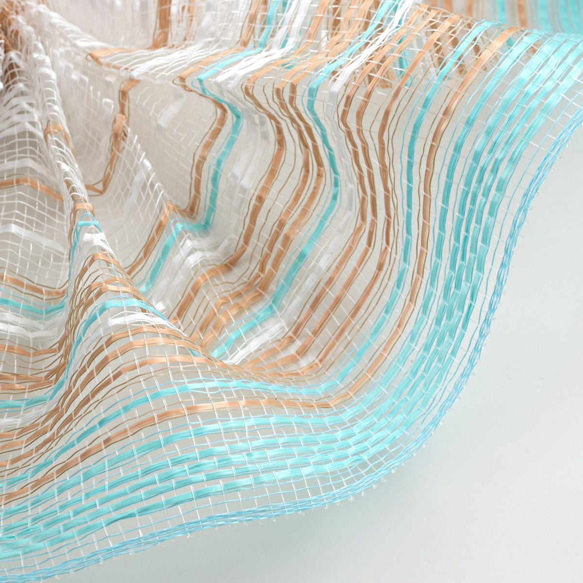 Roll of ombre style blue, natural and white "footprints on the beach" deco mesh