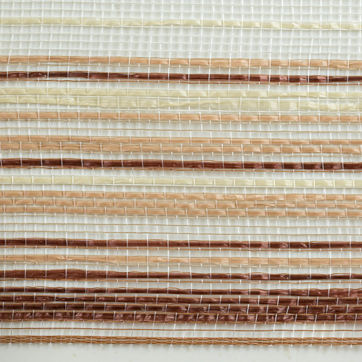 Close up of ombre style chocolate brown, caramel and ivory vertical wide stripe deco mesh weave