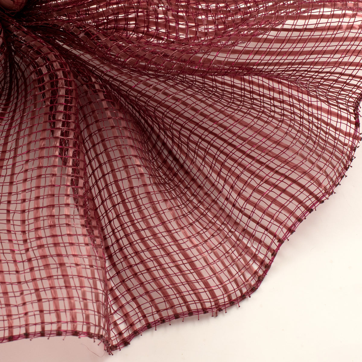 Close up of burgundy horizontal wide stripe deco mesh weave MPN RE890005 carried by Monkey's Creations. 