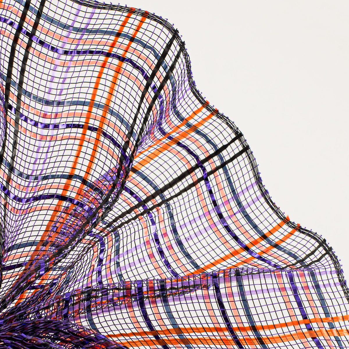 Close up of orange, black and purple plaid vertical wide stripe foil deco mesh weave carried by Monkey's Creations. MPN - RE1368F2.