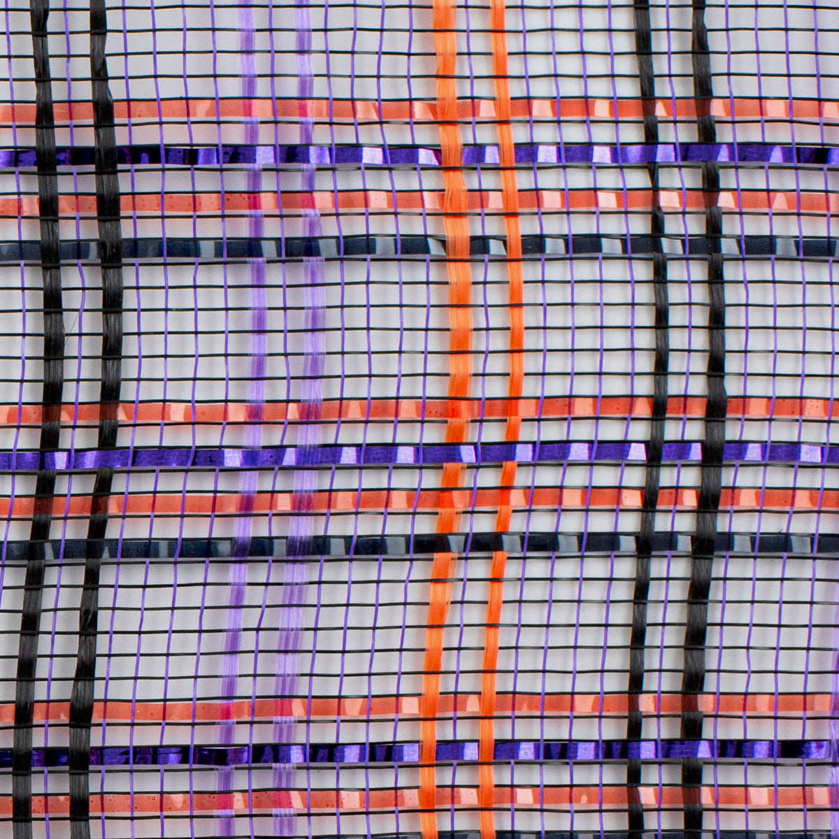 Close up of orange, black and purple plaid vertical wide stripe foil deco mesh weave carried by Monkey's Creations. MPN - RE1368F2.