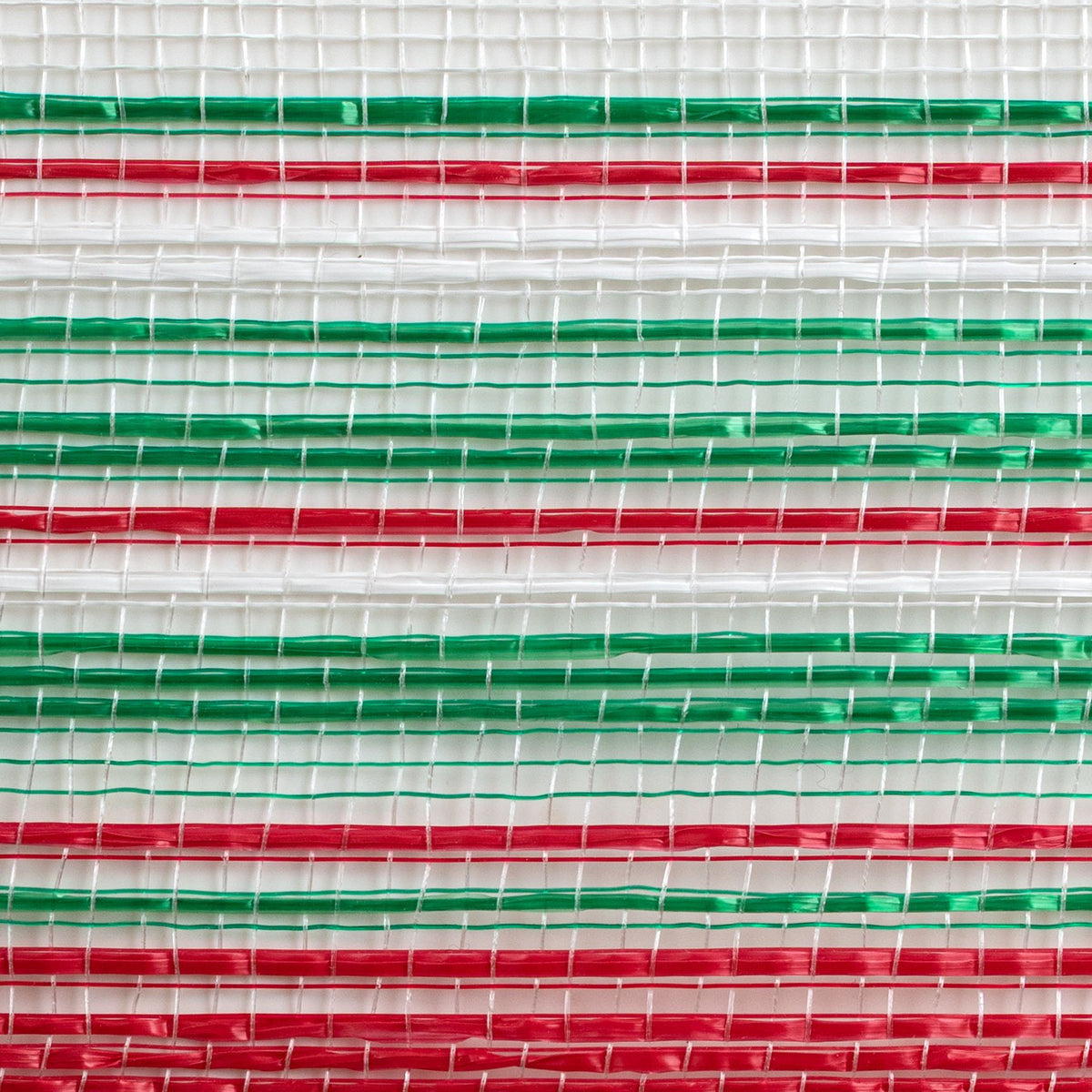 Close up of ombre style red, green and white vertical wide stripe deco mesh weave