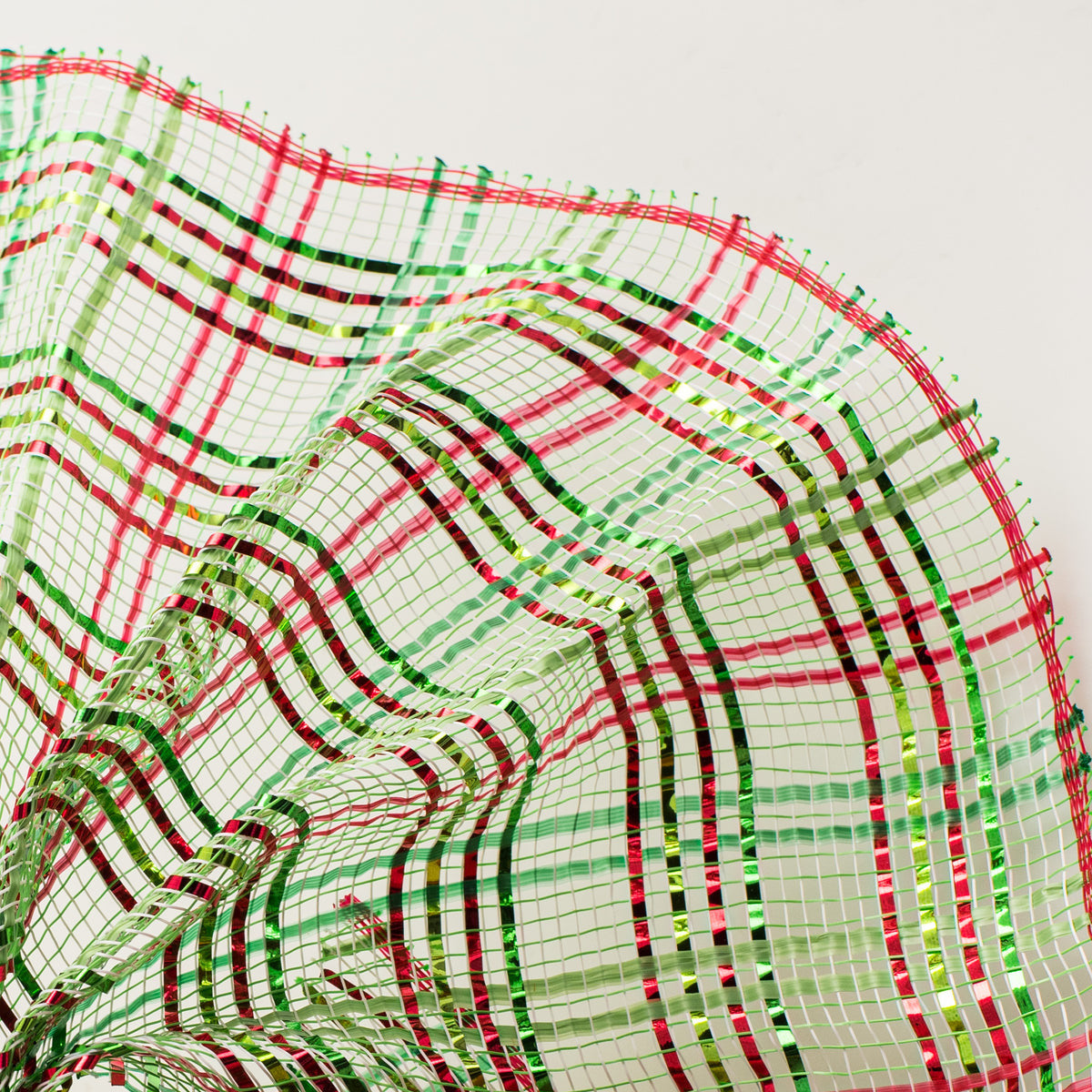 Close up of vertical wide stripe foil plaid lime green, red and emerald green weave deco mesh MPN RE1368XC