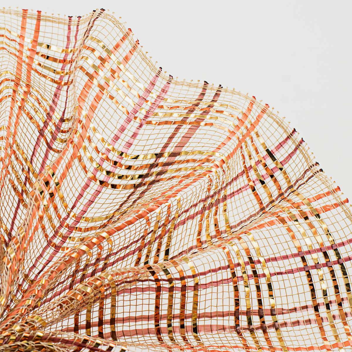 Close up of vertical wide stripe foil plaid natural, orange, brown and burgundy deco mesh wave MPN RE1368XE