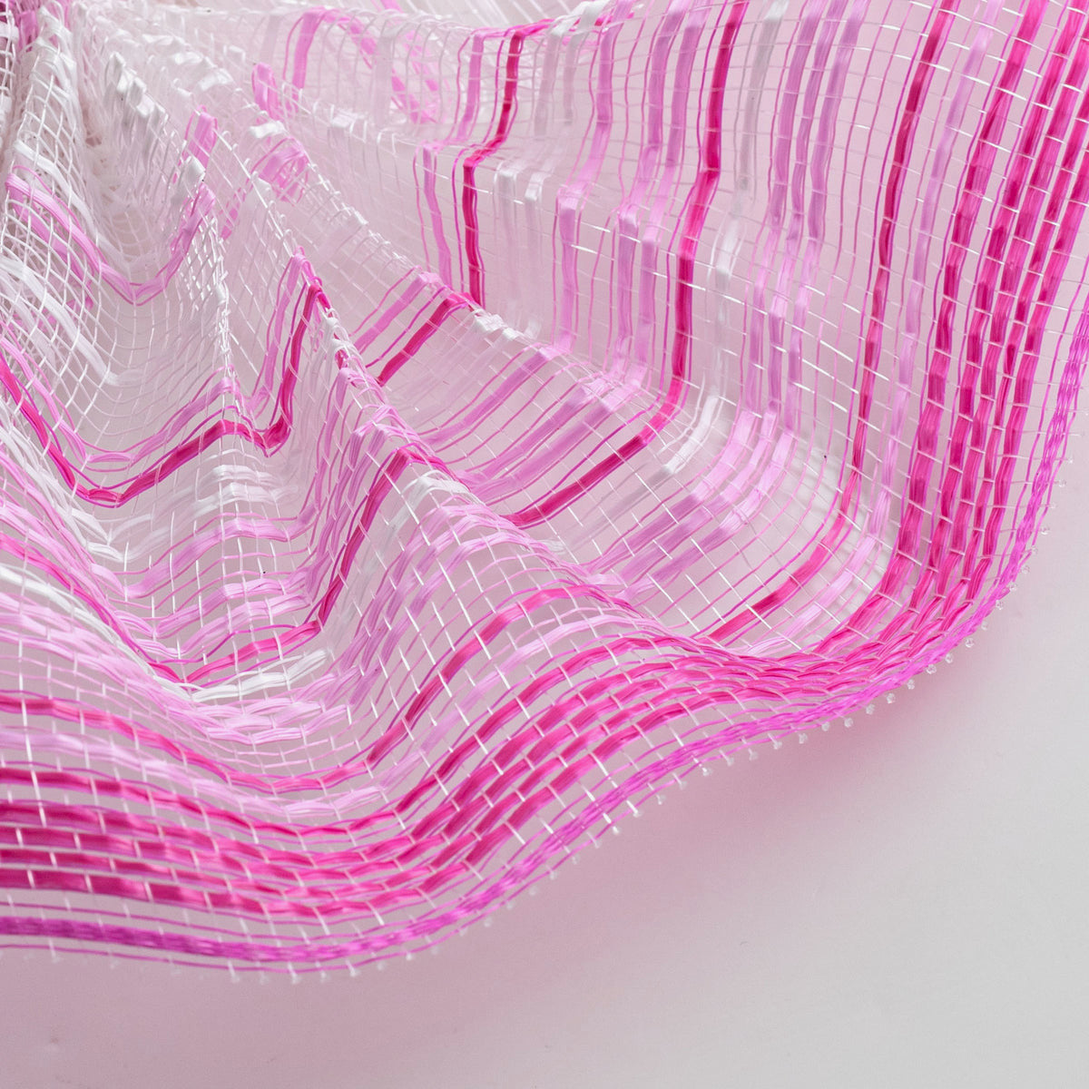 Close up of vertical wide stripe ombre deco mesh weave with hot pink, soft pink, fuchsia, pale pink and white stripes MPN RE13861Y