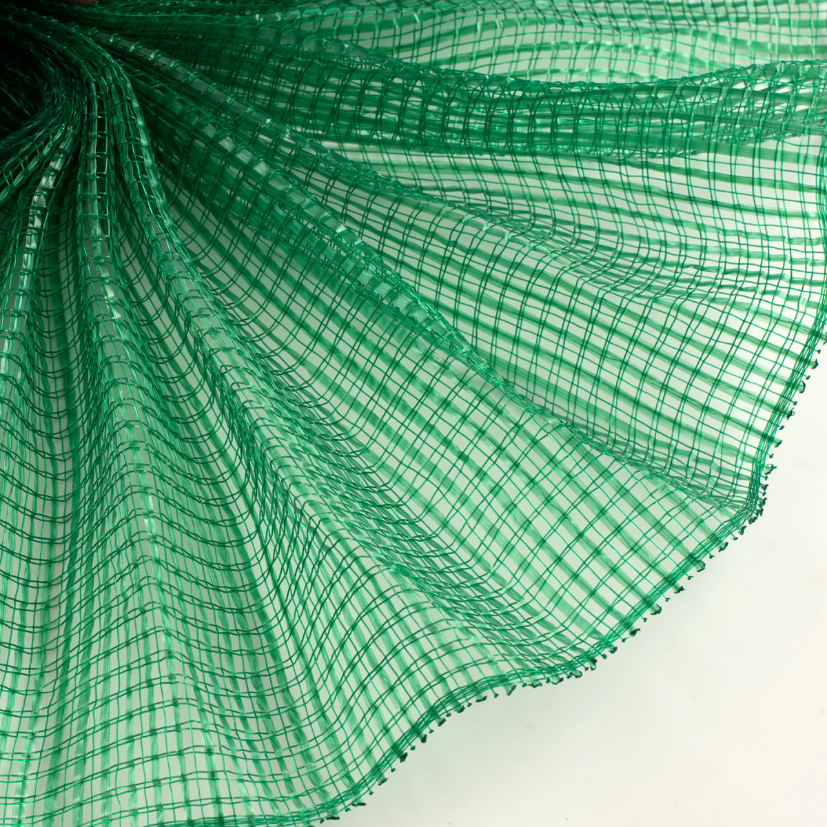 Close up of emerald green horizontal wide stripe deco mesh weave fanned