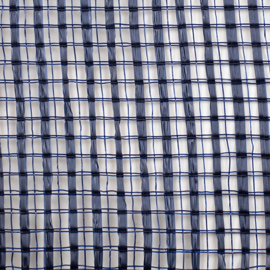 Close-up of a textured natural navy blue wide stripe deco mesh weave  fibers
