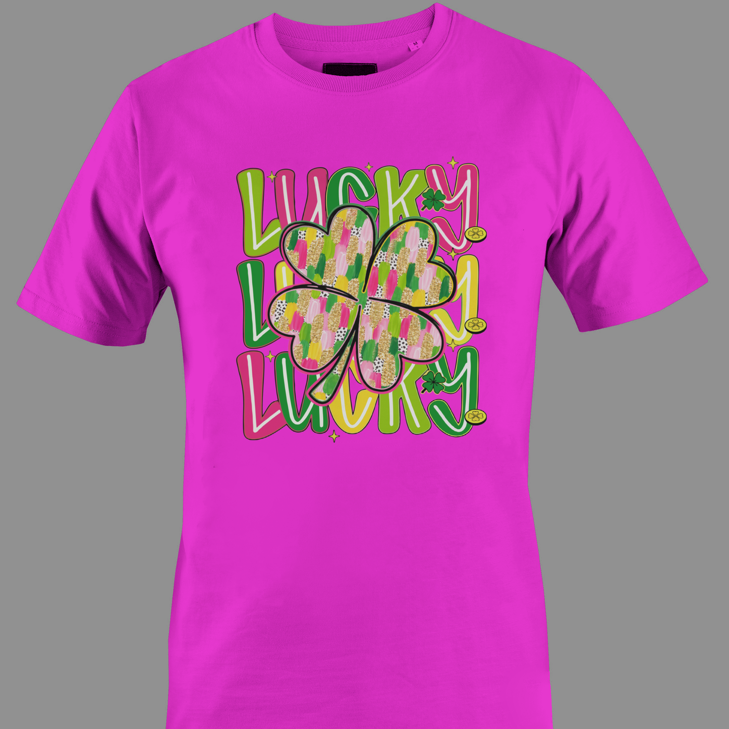 Fuchsia t-shirt with colorful text 'Lucky' and a shamrocks