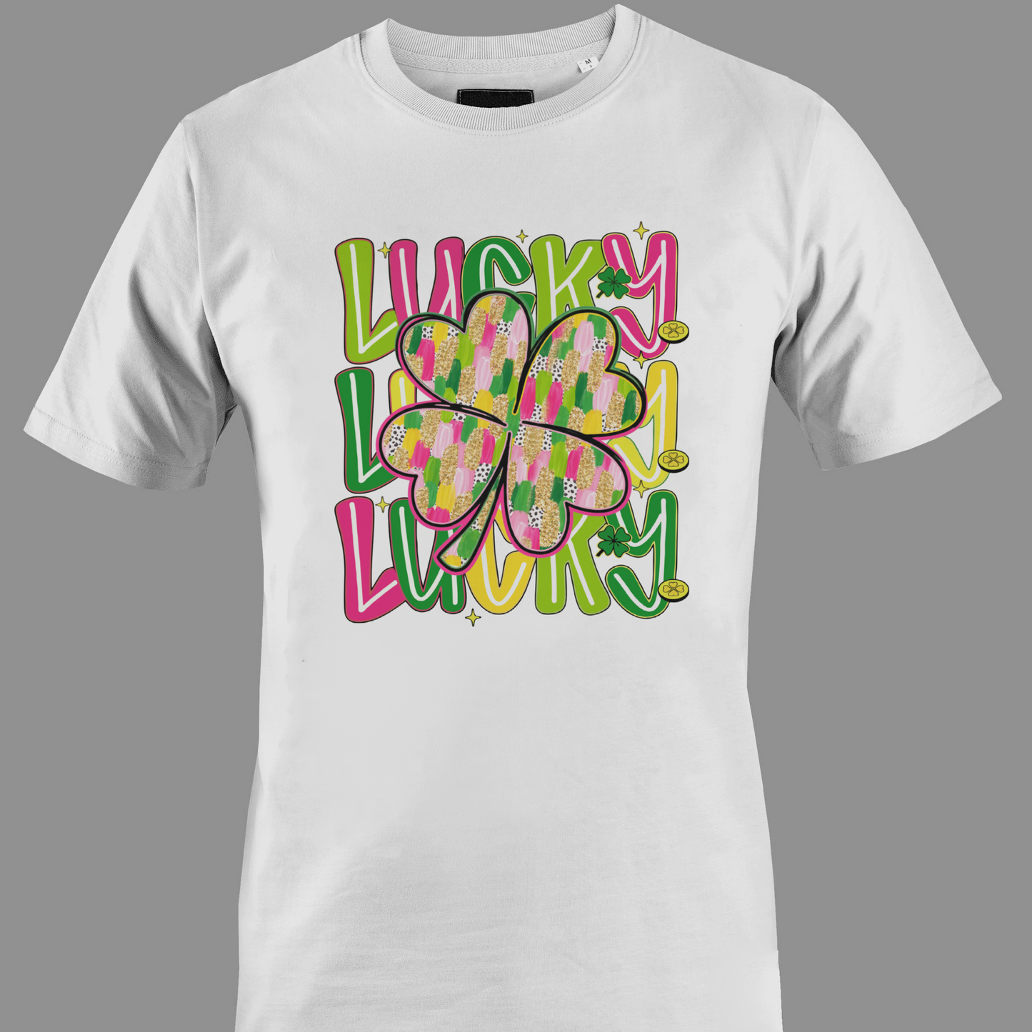 White t-shirt with colorful text 'Lucky' and a shamrocks