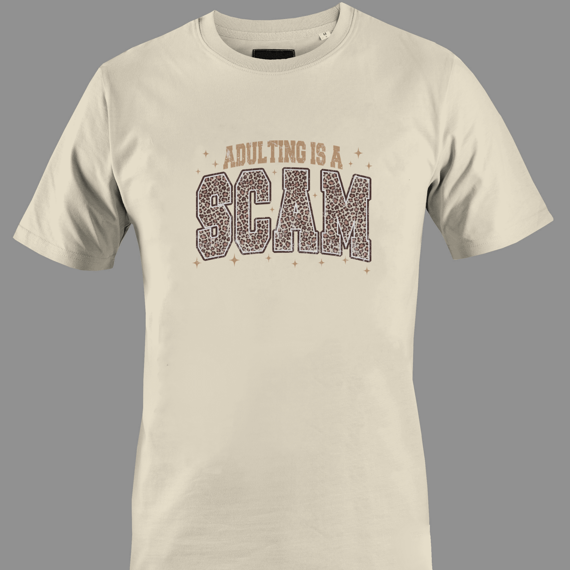 Beige t-shirt with 'Adulting is a Scam' text