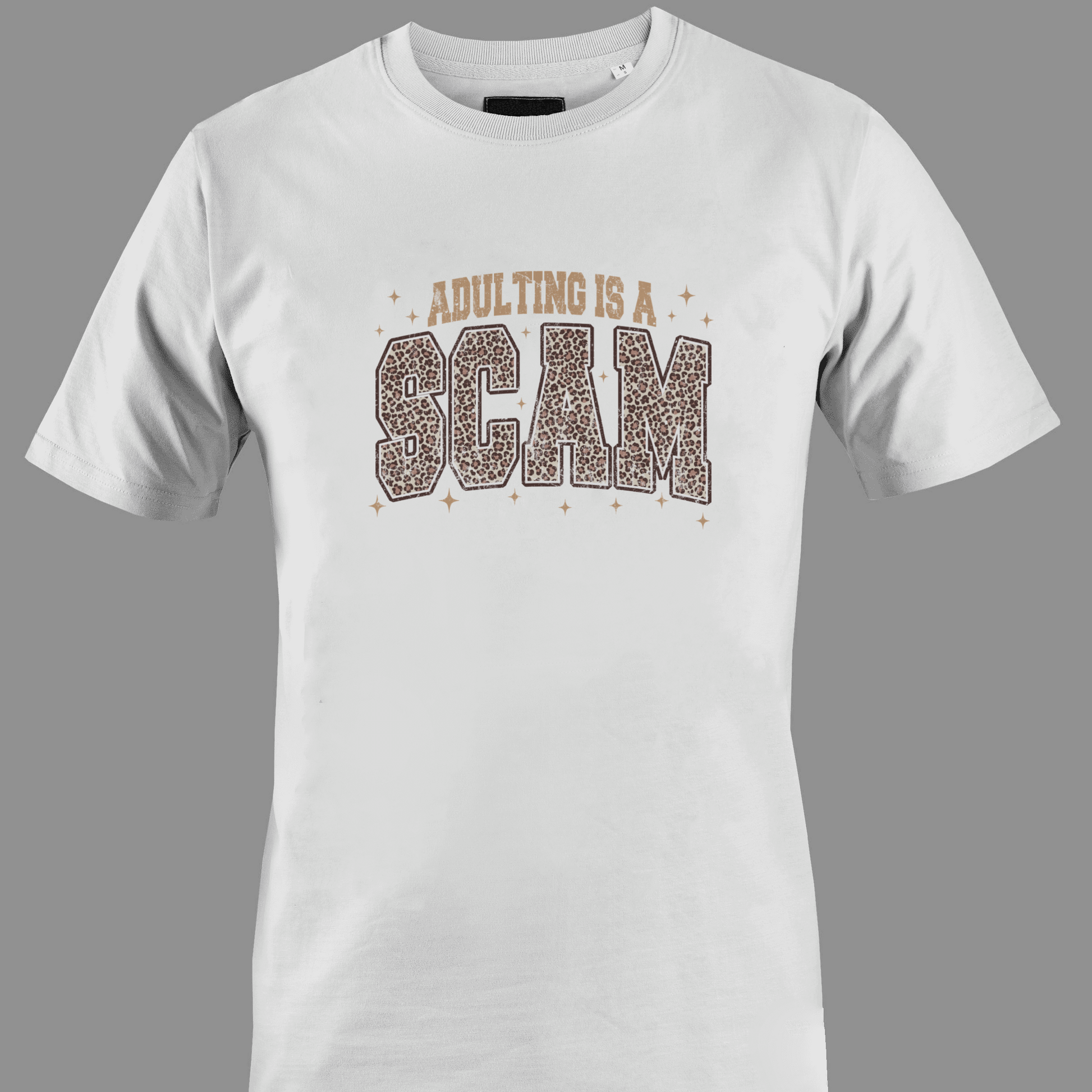 White t-shirt with 'Adulting is a Scam' text