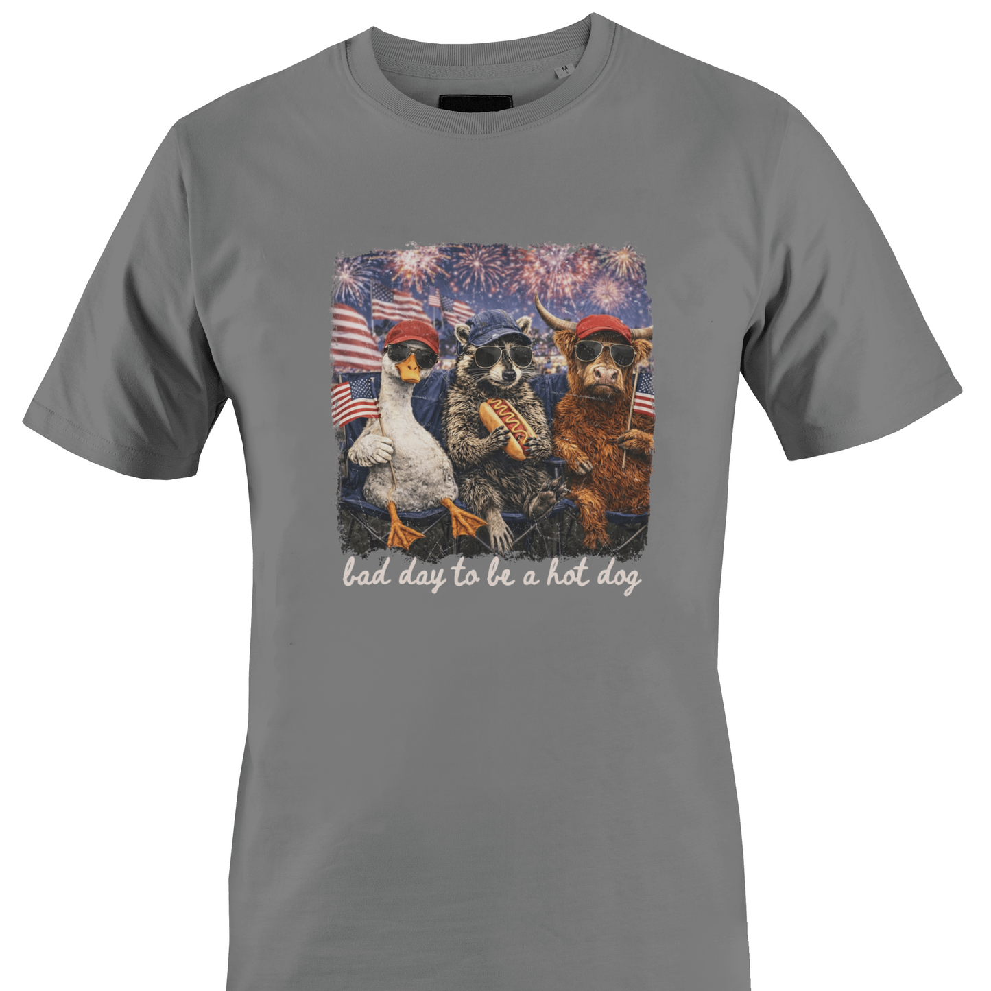 Grey t-shirt with a graphic of animals and text "bad day to be a hot dog" by Monkey's Creations