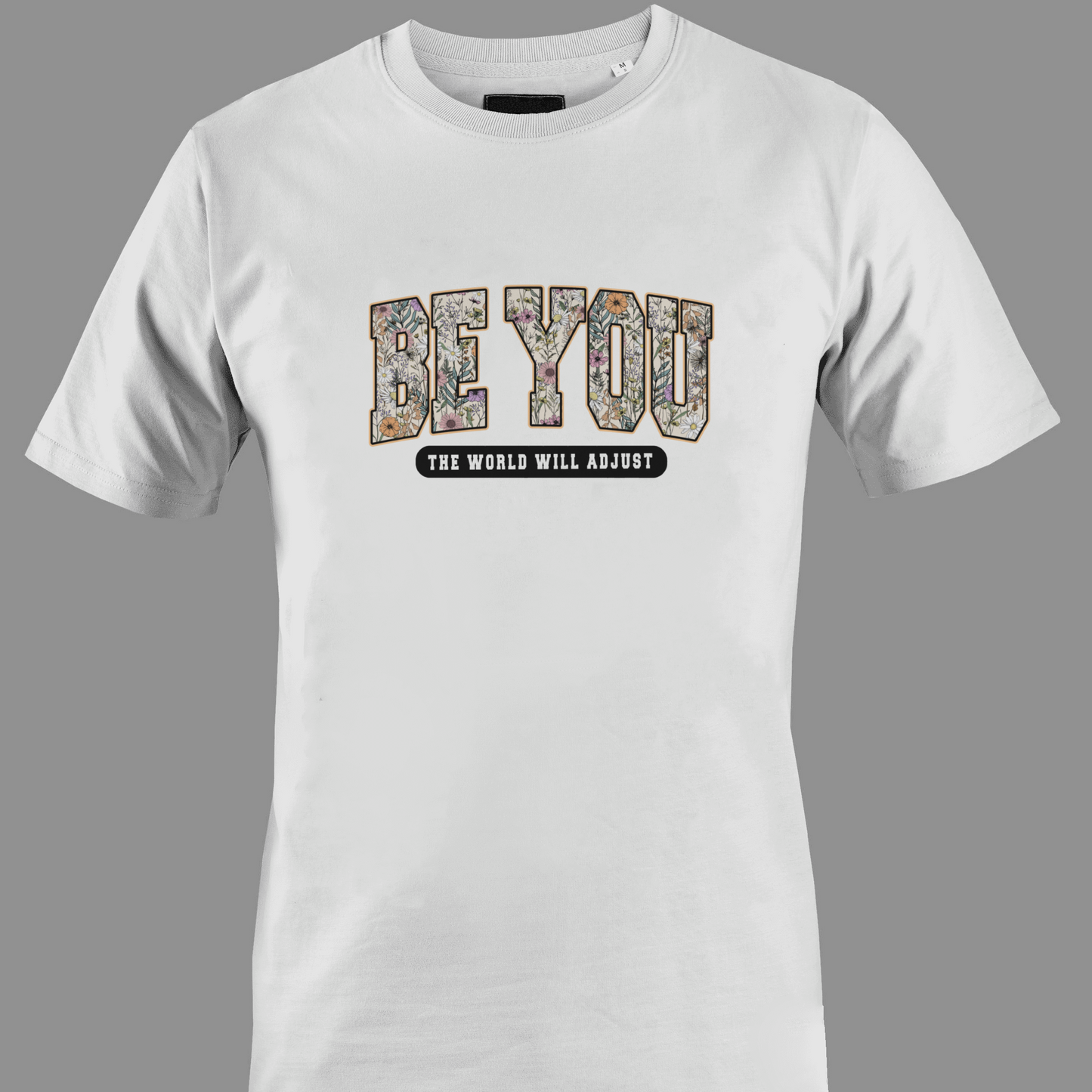 White t-shirt with 'BE YOU THE WORLD WILL ADJUST' text