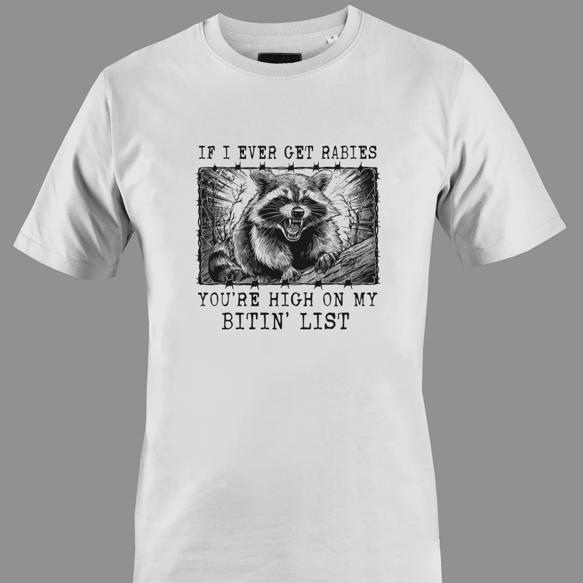 White t-shirt with a graphic of a raccoon and text rabies bite list 