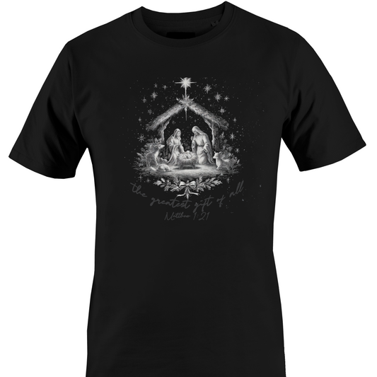 A black short-sleeve crewneck t-shirt featuring a detailed grayscale graphic of the Nativity Holy Family in a stable under a star, with the text 'the greatest gift of all is the present gift of God' and 'Mother of God' written below by Monkey's Creations. 