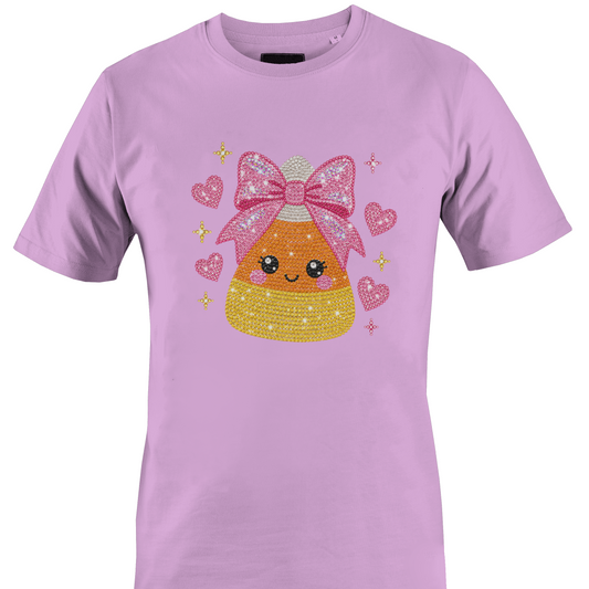Light purple t-shirt featuring a sparkly bling candy corn wearing a pink bow surrounded by hearts for Halloween by Monkey's Creations. 