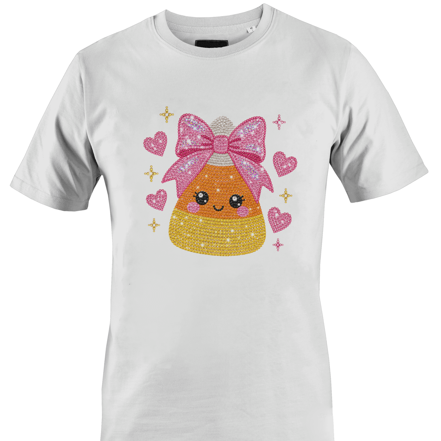 White t-shirt featuring a sparkly bling candy corn wearing a pink bow surrounded by hearts for Halloween by Monkey's Creations. 