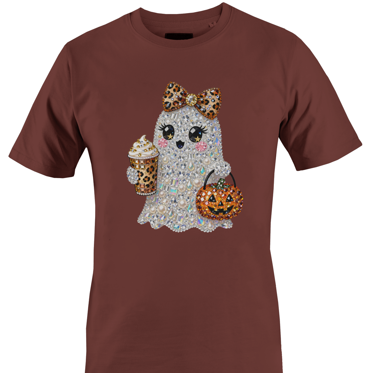 A brown short-sleeve crewneck t-shirt featuring a graphic of a cute ghost character covered in rhinestones, holding a leopard-print pumpkin bucket and a leopard-print drink by Monkey's Creations.