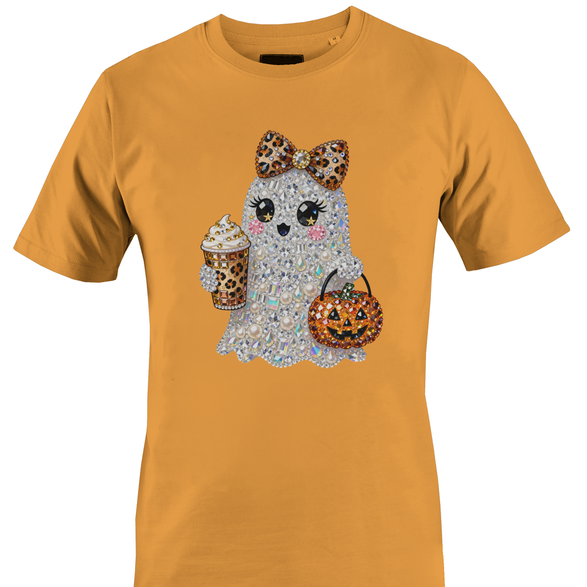 A orange short-sleeve crewneck t-shirt featuring a graphic of a cute ghost character covered in rhinestones, holding a leopard-print pumpkin bucket and a leopard-print drink by Monkey's Creations.