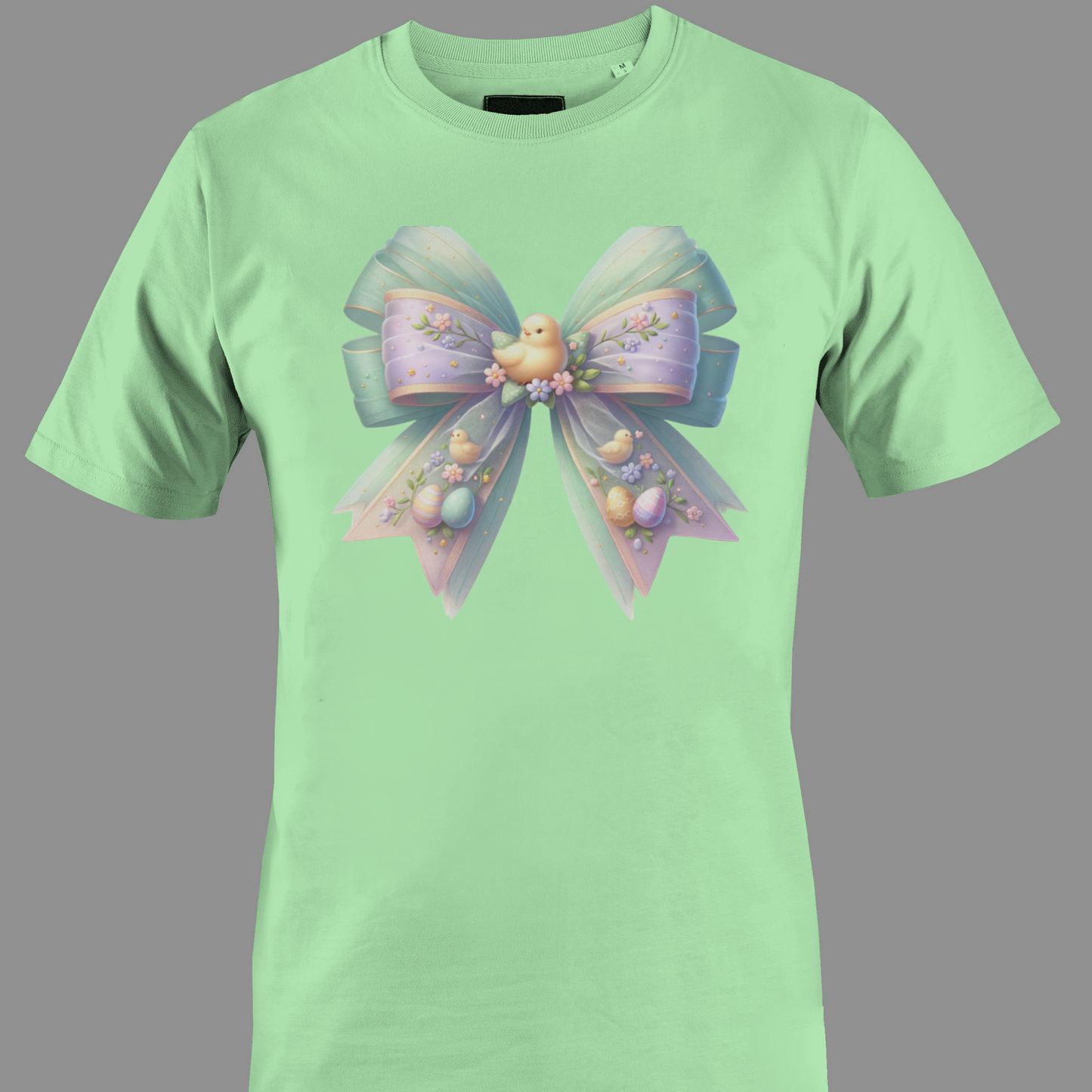 Light green t-shirt with a decorative bow and Easter eggs with a chick 