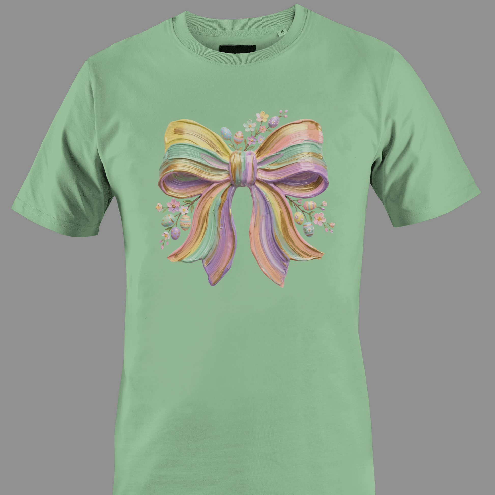 Green t-shirt with a colorful bow design and flowers