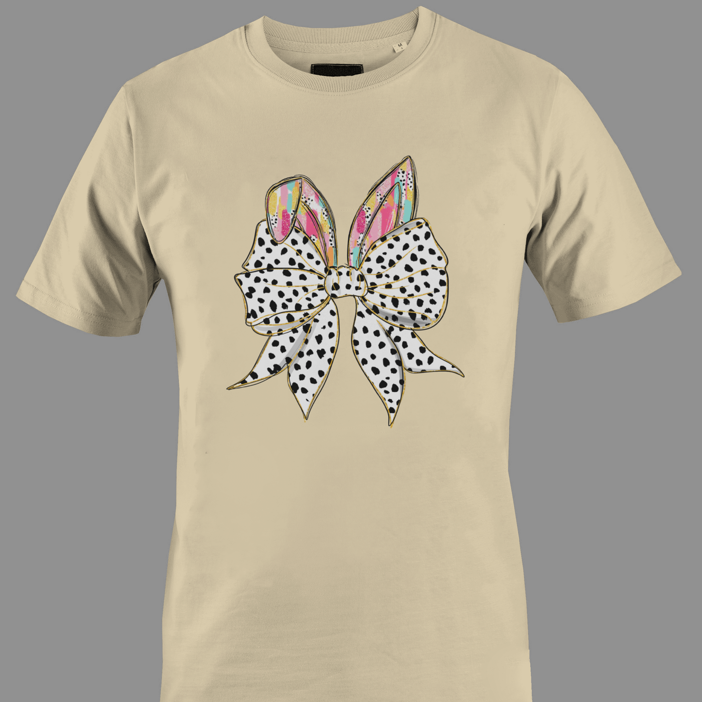 Beige t-shirt with a large polka dot bow and colorful rabbit ears