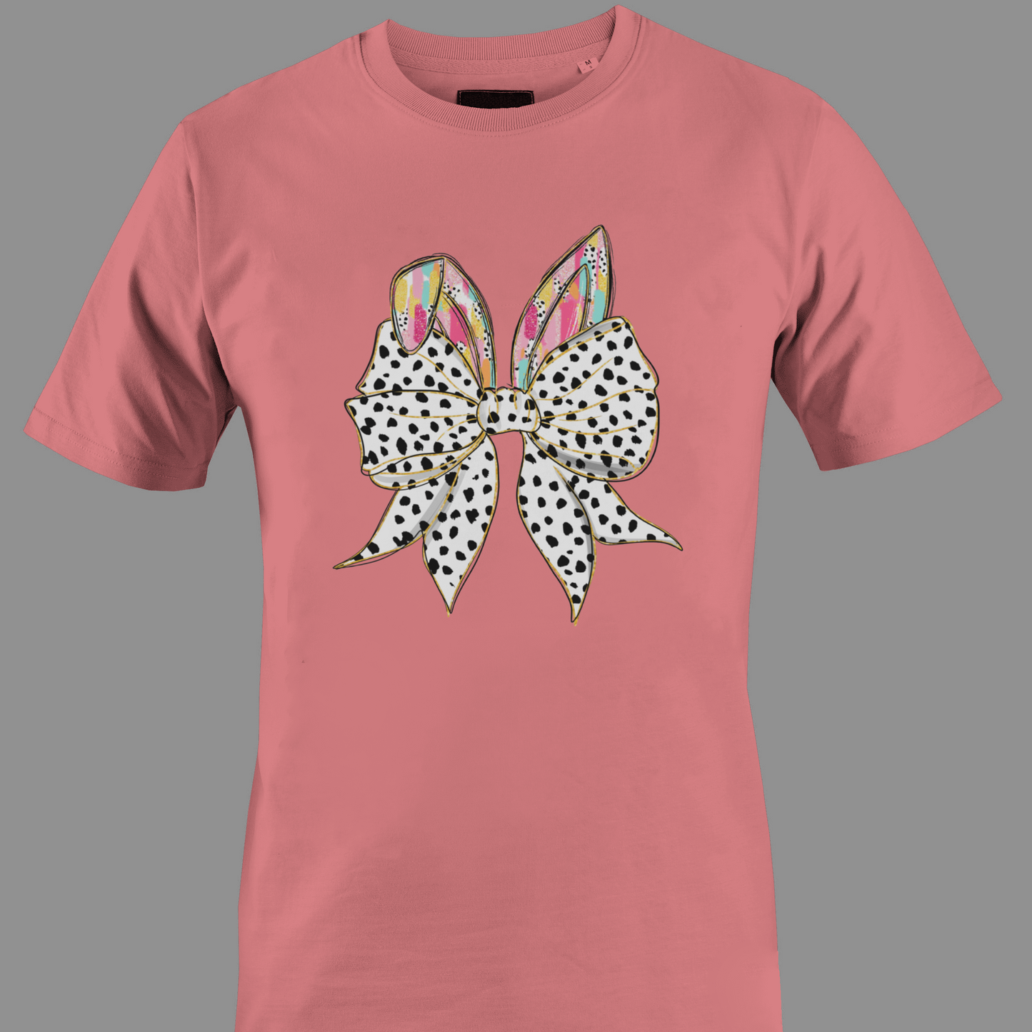 Coral t-shirt with a large polka dot bow and colorful rabbit ears