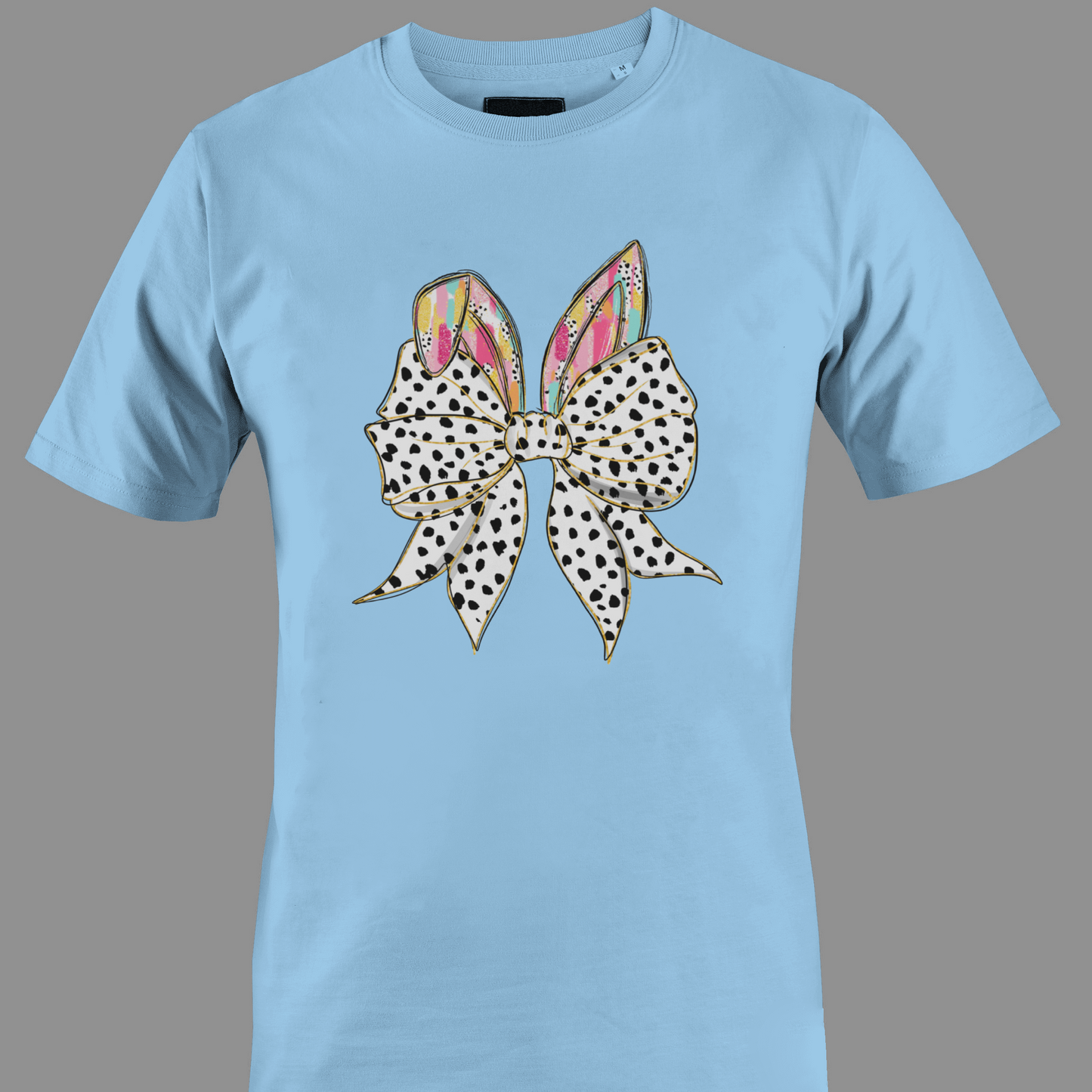 Light blue t-shirt with a large polka dot bow and colorful rabbit ears
