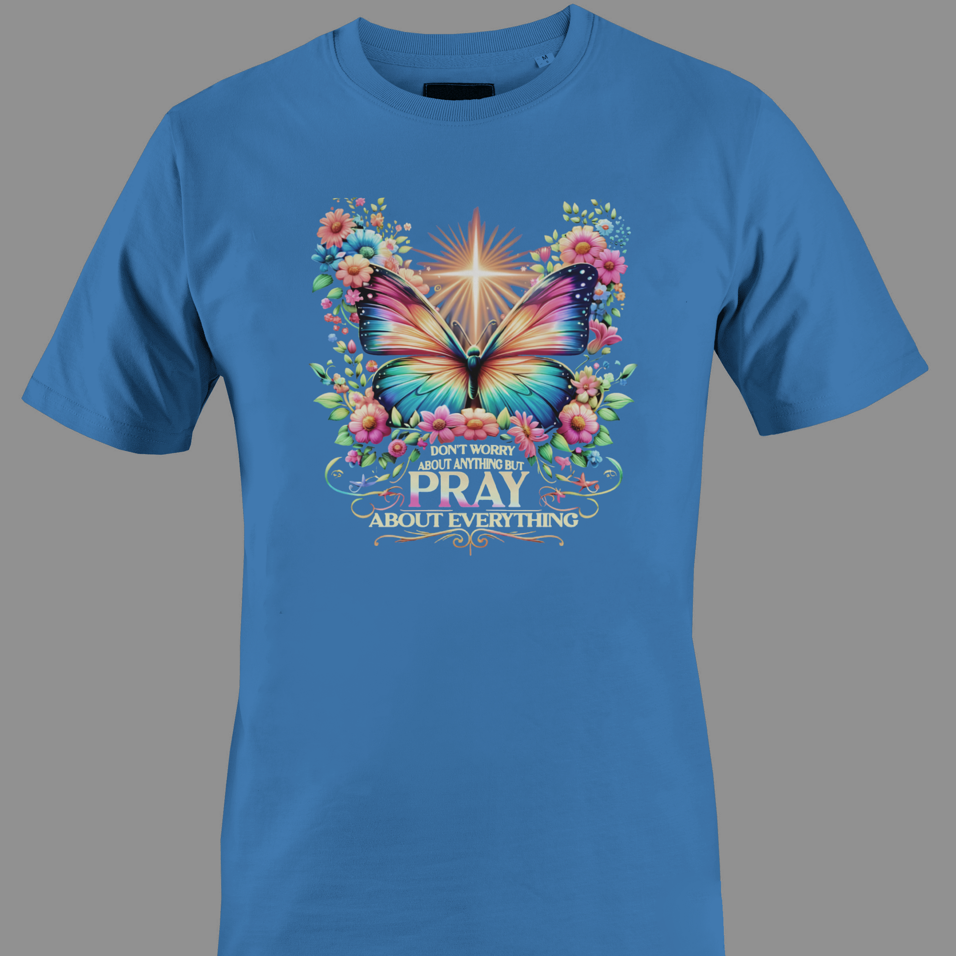 Blue t-shirt with a colorful butterfly and florals with text Pray 