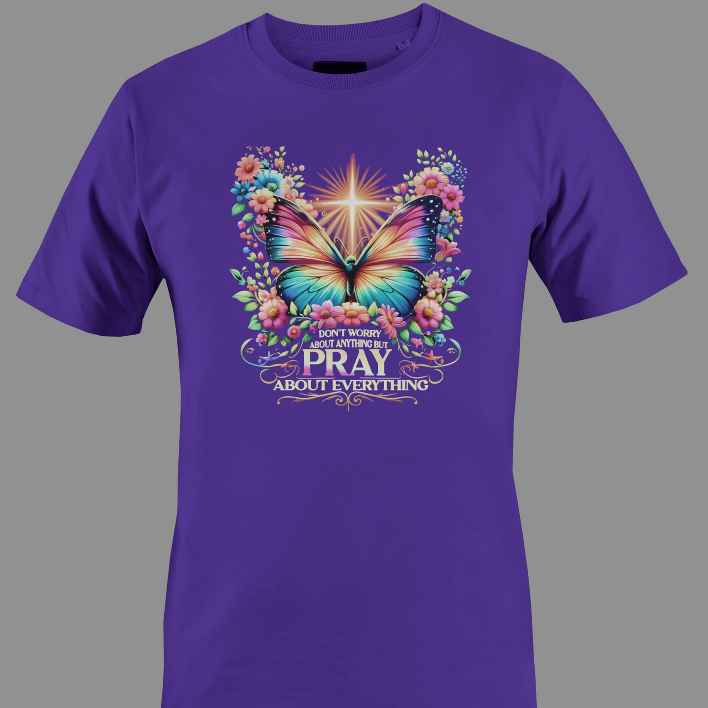 Dark purple  t-shirt with a colorful butterfly and florals with text Pray 